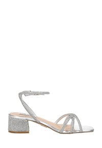 Silver low-heeled sandal with ankle strap and multiple thin glittery straps over toes, featuring a block heel covered in rhinestones.