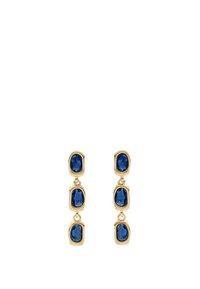 Kultaketjut, joissa on kolme linkitettyä soikeaa sinistä jalokiveä, joista jokaisessa on facettipintainen rakenne, mikä luo sileän ja kiiltävän ilmeen.