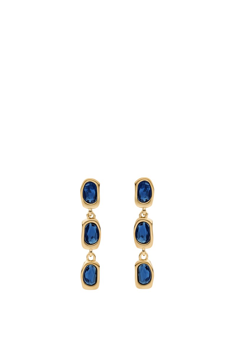 Kultaketjut, joissa on kolme linkitettyä soikeaa sinistä jalokiveä, joista jokaisessa on facettipintainen rakenne, mikä luo sileän ja kiiltävän ilmeen.