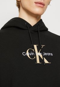 Calvin Klein Jeans ARCHIVAL MONOLOGO HOODIE - Jersey con capucha - ck black