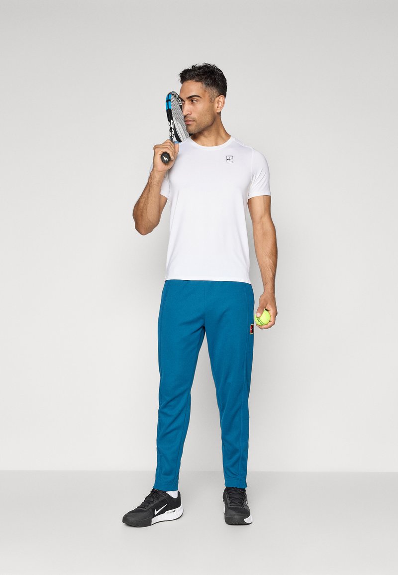 Nike Performance HERITAGE - Teplákové kalhoty - blue force