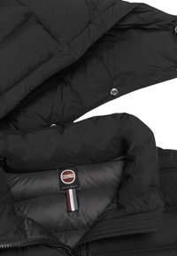 Black puffer jacket with a smooth, glossy exterior. Features a high collar, snap closures, and a branded interior label. Textured fabric.