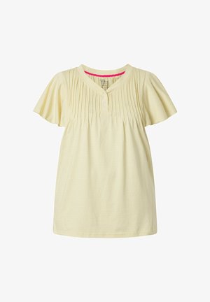 Vaaleankeltainen lyhythihainen pusero, jossa on laskostettu etuosa, pyöreä kaula-aukko, jossa napit ja hienovarainen pilkullinen rakenne.