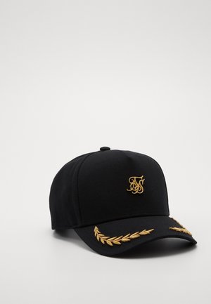 Casquette de baseball noire avec des lauriers brodés en or sur la visière et un logo monogramme stylisé en or sur le panneau avant.