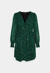 Grön blommig klänning med svart bakgrund, med långa genomskinliga ärmar, djup V-ringning och en samlad midja för form.