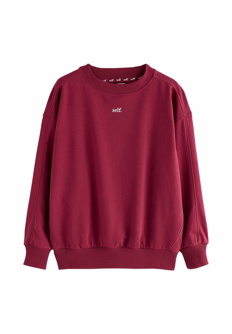 Bordowa bluza z miękkiego materiału, z prążkowanym okrągłym dekoltem i mankietami, z białym logo "self." na przodzie. Luźny fason z elastycznym dołem.