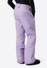 Ανοιχτό μωβ παντελόνι χιονιού με λεία, γυαλιστερή υφή, φαρδιές μπατζάκια και ελαστική μέση∙ διαθέτει τσέπες και ενισχυμένες μανσέτες.