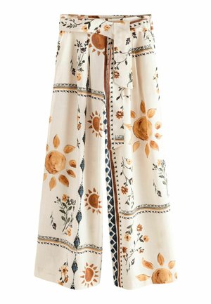 Wide-leg cream pants with brown sun and floral prints, featuring a matching fabric belt and geometric border patterns.