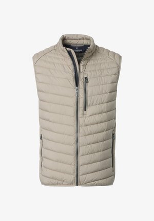 Veste sans manches matelassée beige avec col montant et trois poches zippées noires, dont une poche verticale sur la poitrine.