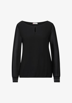 Top negro de manga larga con escote redondo y detalle de corte en forma de ojo de cerradura. Presenta puños elásticos y una textura de tela suave.