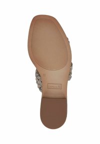 Sole in gomma marrone con superficie texturizzata; chiaro logo del marchio; morbidi cinturini beige decorati con strass per accenti decorativi. Taglia 37.