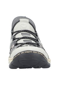Gray and white sneaker with a textured finish, featuring contrasting laces, a stitched sole, and a curved toe design.
