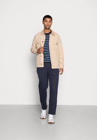 Levi's® XX CHINO EZ TAPER II - Hlače - navy