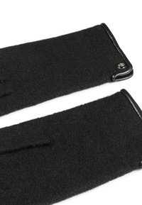 Schwarze Wollhandschuhe mit Lederbesatz, die eine glatte Textur aufweisen und ein kleines dekoratives Logo am Bündchen haben. Keine Finger sind sichtbar.