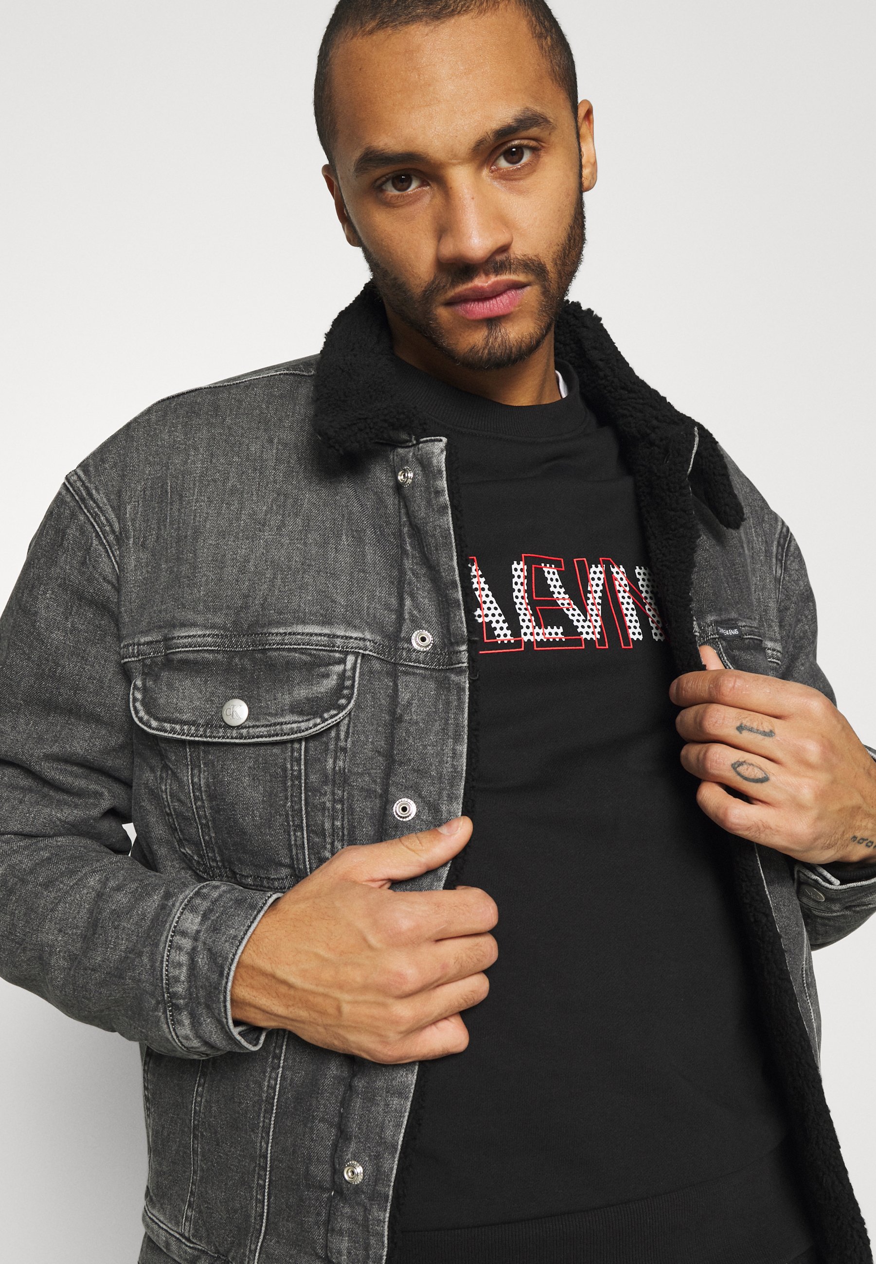 grey jeans black jacket