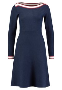 Navy long-sleeve dress with a fitted bodice, flared skirt, and white and red striped accents at the neckline and sleeves. Textured fabric.