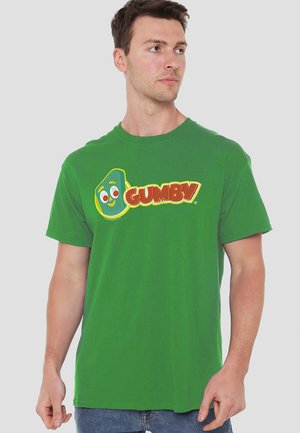 Green cotton t-shirt featuring a large, colorful "Gumby" graphic on the front. Classic crew neck and relaxed fit. Short sleeves.