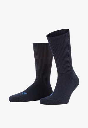 Zwarte geribde sokken met een zachte textuur, voorzien van een versterkte teen en hiel. Inclusief klein blauw logo nabij de teen.