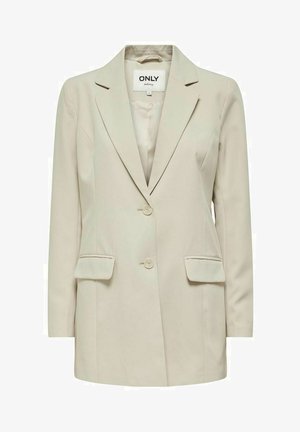 Ljusbeige kavaj i slätt tyg, med slagkrage, två knappar och två framfickor. Enkel, skräddarsydd design.