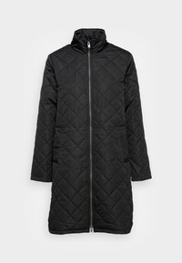 Svart kviltad jacka med ståkrage, hel dragkedja framtill och långa ärmar. Utmärker sig med ett diamantsmönster och sidfickor. Slät tygtextur.