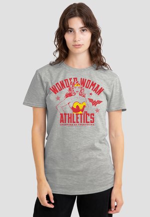 Gray cotton t-shirt featuring red and yellow Wonder Woman graphic text, short sleeves, and a classic fit. The design includes stars and slogan.