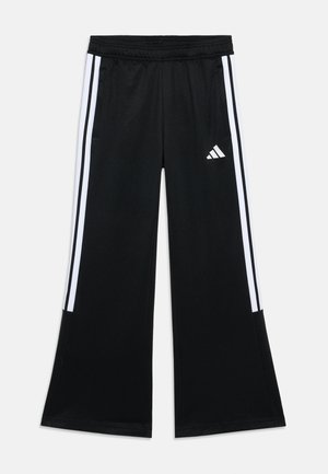 Black athletic pants with a wide-leg design, featuring white side stripes and an Adidas logo. Made from smooth, lightweight material.