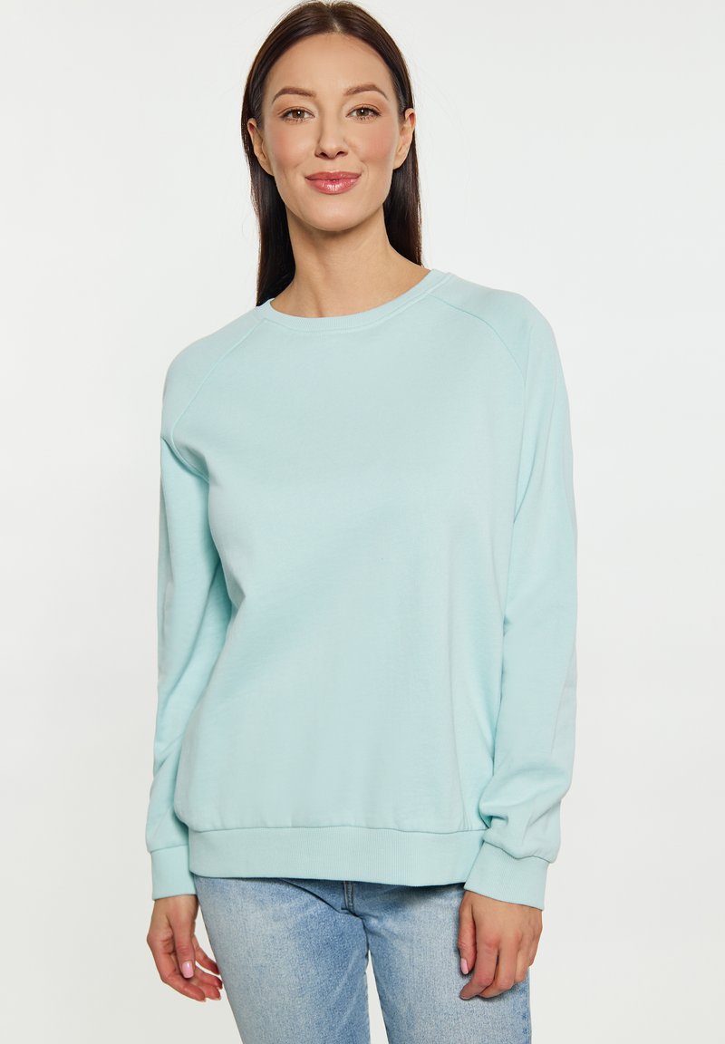Felpa in cotone azzurro chiaro con collo rotondo, maniche raglan e vestibilità rilassata, dotata di polsini e orlo a coste.