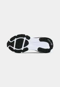 Schoenzool met zwart rubberen profiel, segmenten op een witte basis, met geometrische patronen en de tekst "NIKE STORM-TREAD" op het hielgebied.