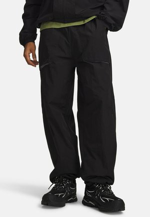 Under Armour, UNDER ARMOUR FLEECE BOTTOMS UA UNSTOPPABLE CW PANTS - Долнище на анцуг - ultimate black