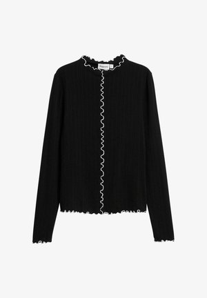 Cardigan noir à manches longues côtelé avec une bordure ondulée blanche le long du col, de l'ouverture avant, des poignets et de l'ourlet.