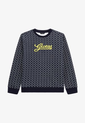 Sweatshirt navy avec motif gris clair répétitif, présente un logo "Guess" jaune sur la poitrine, col et poignets côtelés, fabriqué à partir de tissu doux.