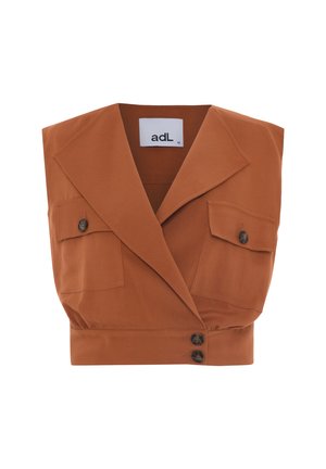 Cropped rust-colored top with a lapel collar, two front pockets, and three buttons. Made of smooth fabric with a tailored design.