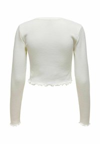 Hvit langermet cropped topp med bølgekant i nederkant og på mansjettene, vist bakfra på hvit bakgrunn.