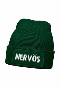 Green knit beanie with a rolled cuff and a rectangular patch displaying the word "NERVÖS" in white, featuring a textured fabric.