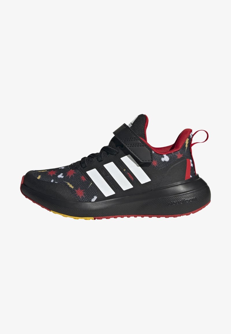 Scarpa sportiva nera con motivo foglia multicolore, dettagli rossi e tre strisce bianche. Presenta una fibbia in velcro e suola texture.