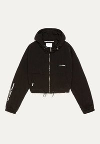 Black cropped jacket with a hood, zipper closure, and drawstring hem. Features text on sleeves and a soft, slightly textured fabric.