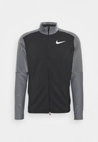 Zwarte sportjack met een rits aan de voorkant, hoge kraag en contrasterende verticale gestreepte mouwen. Bevat een wit Nike-logo op de borst.
