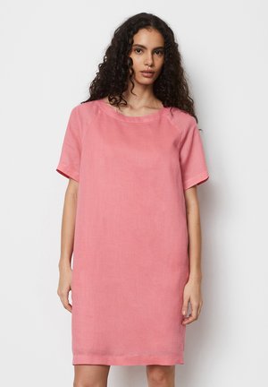 Pink linen dress with short sleeves, a rounded neckline, and a straight cut. Smooth texture and knee-length design. No visible patterns or embellishments.