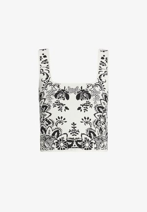 Schwarzes und weißes gemustertes Crop-Top mit einem quadratischen Ausschnitt, das florale und geometrische Designs aufweist, hergestellt aus einem strukturierten, leichten Stoff.