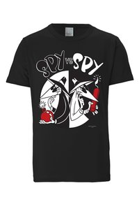 Black t-shirt featuring "Spy vs. Spy" graphic. Design includes two spies in contrasting colors, one with a red bomb, the other with a lit dynamite stick.