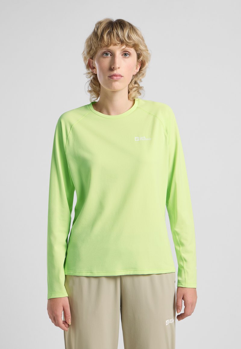 Maglietta a maniche lunghe di un brillante verde lime realizzata in tessuto morbido con scollo rotondo e un sottile logo sul petto. Maniche raglan.