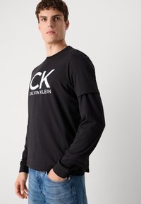 Calvin Klein Jeans GRAPHIC TEE - T-shirt print - black