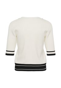 Balts īsroku adīts džemperis ar melnām un baltām svītrainām aprocēm un apakšu, attēlots no aizmugures uz balta fona.