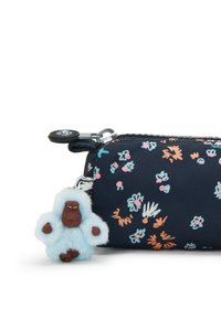 Astuccio con cerniera in tessuto scuro con motivi floreali colorati. Presenta un charm di gorilla blu soffice attaccato al cursore della cerniera.
