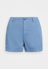 Blå bomullsbyxor med flat front, knappstängning och bälteshällor. Har raka ben och en slät textur. Inga mönster eller detaljer.