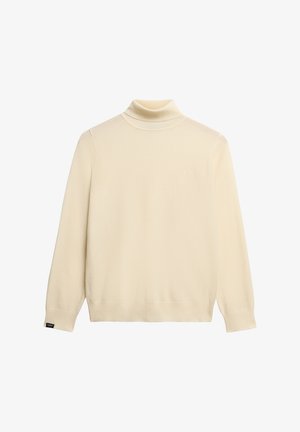 Cream turtleneck sweater made of soft knit fabric. Features long sleeves, ribbed cuffs, and hem, with a small logo on the front.