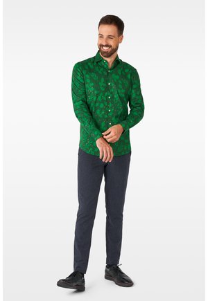 Green long-sleeve shirt with leaf-patterned design, button-up front, and a regular fit, paired with dark textured trousers and black shoes.