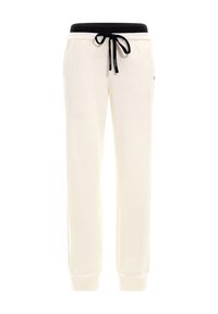 Crème-kleurige joggingbroek met een zwarte elastische tailleband en koord. Kenmerkt zich door taps toelopende pijpen en contrasterende stikseldetails.