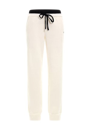 Pantaloni de jogging crem cu o talie elastică neagră și șnur. Au picioare tapered și detalii de cusătură contrastante.
