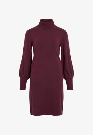 Bordo ilga rankovė su aukštu kaklu ir laisvomis, balioninėmis rankovėmis. Pagaminta iš minkštos medžiagos, su raišteliais ant rankogalių ir apdailos.